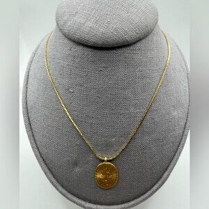 #005 Vintage gold tone necklace with etched flower detailing oval shape pendant